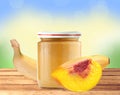 Jar of baby puree, peach and banana on wooden table over nature Royalty Free Stock Photo