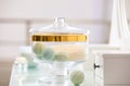 Jar with bath bombs and bath sponge on dressing table Royalty Free Stock Photo