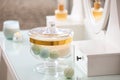 Jar with bath bombs and bath sponge on dressing table Royalty Free Stock Photo