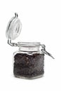 A jar with black peppercorns. Royalty Free Stock Photo