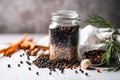 jar of black peppercorns, surrounded by other key ingredients of a simple and delicious recipe Royalty Free Stock Photo