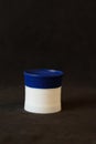 jar with blue cap and white body Royalty Free Stock Photo