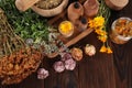 Jar, bottles of essential oils and different herbs on wooden table, above view. Space for text Royalty Free Stock Photo