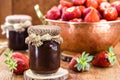 Jar of Brazilian strawberry jam, with copper jar in the background with fresh and organic strawberries Royalty Free Stock Photo