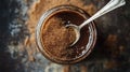 A jar of brown sugar with a spoon, showcasing its texture and culinary use Royalty Free Stock Photo