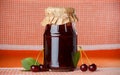 Jar of cherry jam Royalty Free Stock Photo