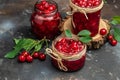 Jar of cherry jam and sour cherries. Berries cherry with syrup. Ripe ripe Sweet red cherries. Canned fruit on a dark background Royalty Free Stock Photo