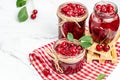 Jar of cherry jam and sour cherries. Berries cherry with syrup. Ripe ripe Sweet red cherries. Canned fruit on a light background Royalty Free Stock Photo