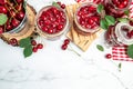 Jar of cherry jam and sour cherries. Berries cherry with syrup. Ripe ripe Sweet red cherries. Canned fruit on a light background Royalty Free Stock Photo