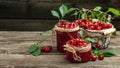 Jar of cherry jam and sour cherries. Berries cherry with syrup on a wooden background. Long banner format Royalty Free Stock Photo