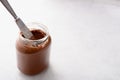 Jar of chocolate-nut paste spread and toast with copy space Royalty Free Stock Photo