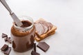 Jar of chocolate-nut paste spread and toast with copy space Royalty Free Stock Photo