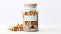 a jar of cinnamon sticks with a blank label and star anise on the side