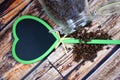 Jar of coffe beans and heart of blackboard. Royalty Free Stock Photo