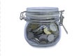 A jar of coins isolated on a white background Royalty Free Stock Photo