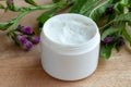 A jar of comfrey cream with fresh symphytum plant Royalty Free Stock Photo