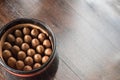 Jar of cuban cigars on hardwood table Royalty Free Stock Photo