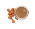 Jar with delicious almond butter and nuts on white background, top view