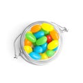 Jar of delicious color jelly beans on white, top view Royalty Free Stock Photo