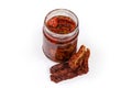 Jar of dried tomatoes in oil and dry tomatoes separately