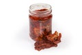 Jar of dried tomatoes in oil and dry tomatoes separately