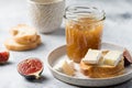 Jar of fig jam and toasted bread with brie cheese Royalty Free Stock Photo