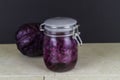 Red cabbage sauerkraut with cabbage behind, blurred Royalty Free Stock Photo