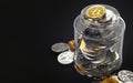 Jar full of cryptocurrencies isolated on black background with copy space on the left. Hold concept. Realistic 3D rendering