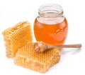 Jar full of fresh honey and honeycombs.