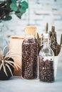 Jar of glass with a Wine corks lid with Coffee beans on old wooden Counter Royalty Free Stock Photo