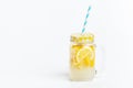 A jar of homemade lemonade and lemons on a white background Royalty Free Stock Photo