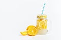 A jar of homemade lemonade and lemons on a white background Royalty Free Stock Photo