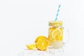 A jar of homemade lemonade and lemons on a white background Royalty Free Stock Photo