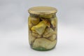Jar of homemade marinated porcini mushrooms closeup