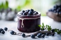 Jar with homemade marmalade or jam with blueberry fruits