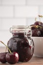 Jar of Homemdae Cherry Jam on a Rustic Wooden Table Royalty Free Stock Photo