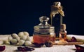 Jar of honey, a bottle with oil and a bottle of pink water on a white towel, for spa treatments