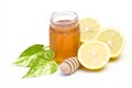 Jar of honey, lemon and wooden drizzler