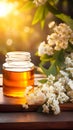 A jar of honey and a lilac flower on a cutting kitchen wooden board, blurred background