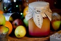 A jar of honey in the middle of citrus, lit garland.The warm atmosphere of the holidays. And vitamins during illness Royalty Free Stock Photo