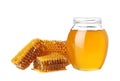 Jar of honey and pieces of fresh combs