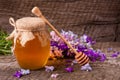 Jar of honey with wildflowers on old wooden background Royalty Free Stock Photo