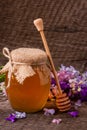 Jar of honey with wildflowers on old wooden background Royalty Free Stock Photo