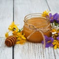 Jar of honey with wildflowers Royalty Free Stock Photo