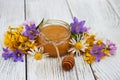 Jar of honey with wildflowers Royalty Free Stock Photo