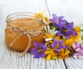 Jar of honey with wildflowers Royalty Free Stock Photo