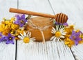 Jar of honey with wildflowers Royalty Free Stock Photo