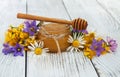 Jar of honey with wildflowers Royalty Free Stock Photo