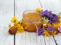 Jar of honey with wildflowers Royalty Free Stock Photo