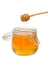 Jar of honey with wooden drizzler Royalty Free Stock Photo
